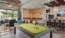 a pool table in a clubhouse room
