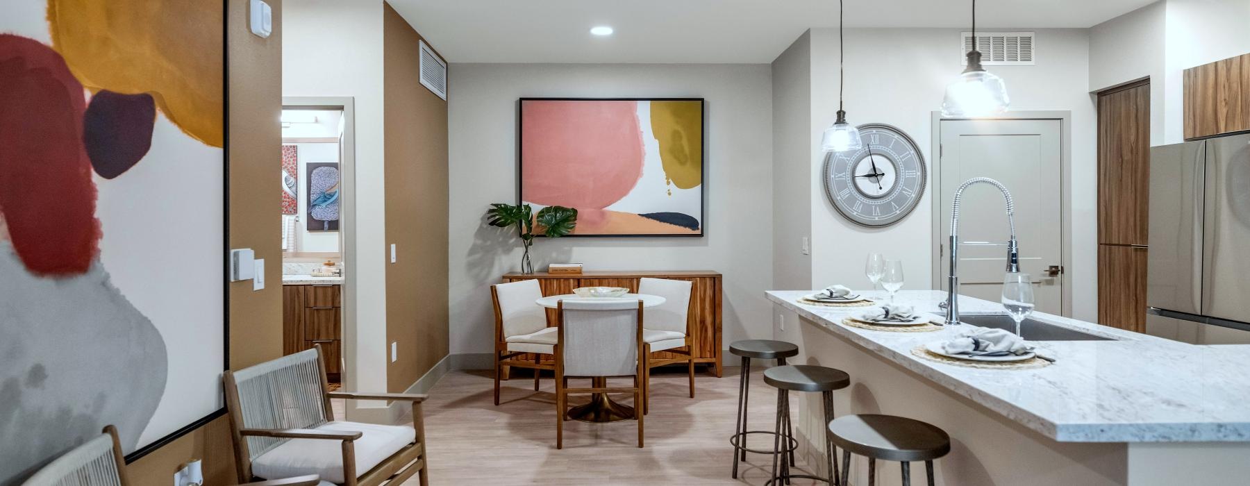a kitchen with a table and chairs