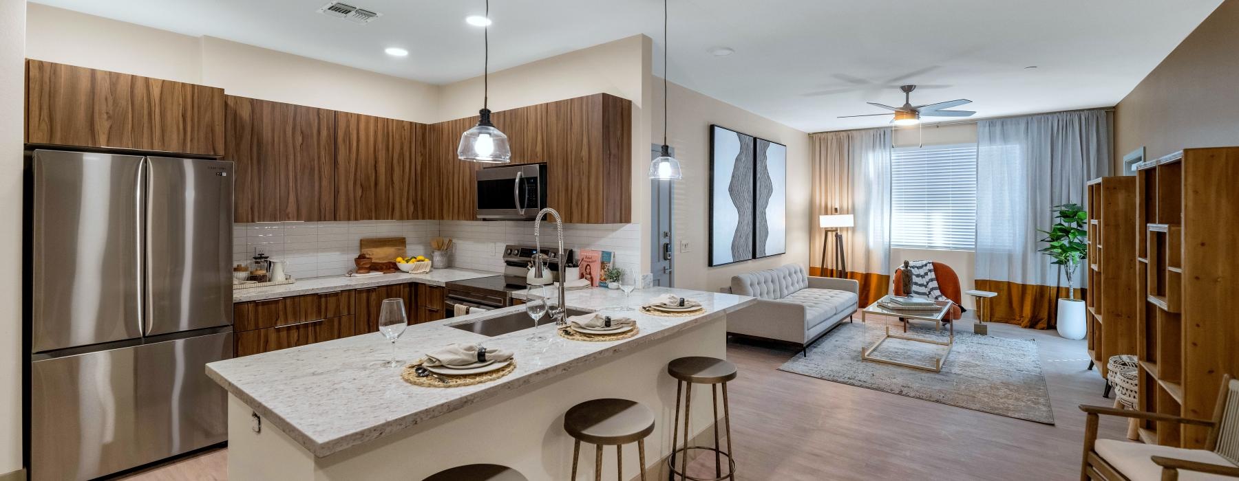 a kitchen with a bar and a dining table