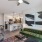 a living room with a green couch