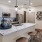 a kitchen with stools and bar stools
