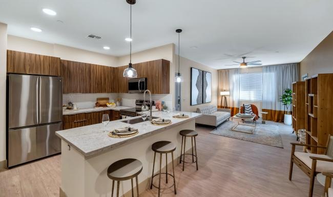 a kitchen with a bar and a dining table