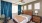 a bedroom with a bed and a fan