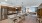 a kitchen with a bar and a dining table