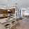 a kitchen with a bar and a dining table
